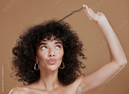Hair care, black woman and hairstyle health texture of a model holding afro to show salon results. Beauty, skincare and natural skin glow of a young woman think about cosmetic wellness and hair style