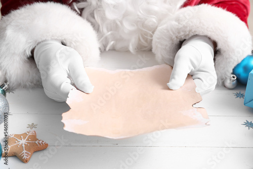 Santa Claus holding blank l...