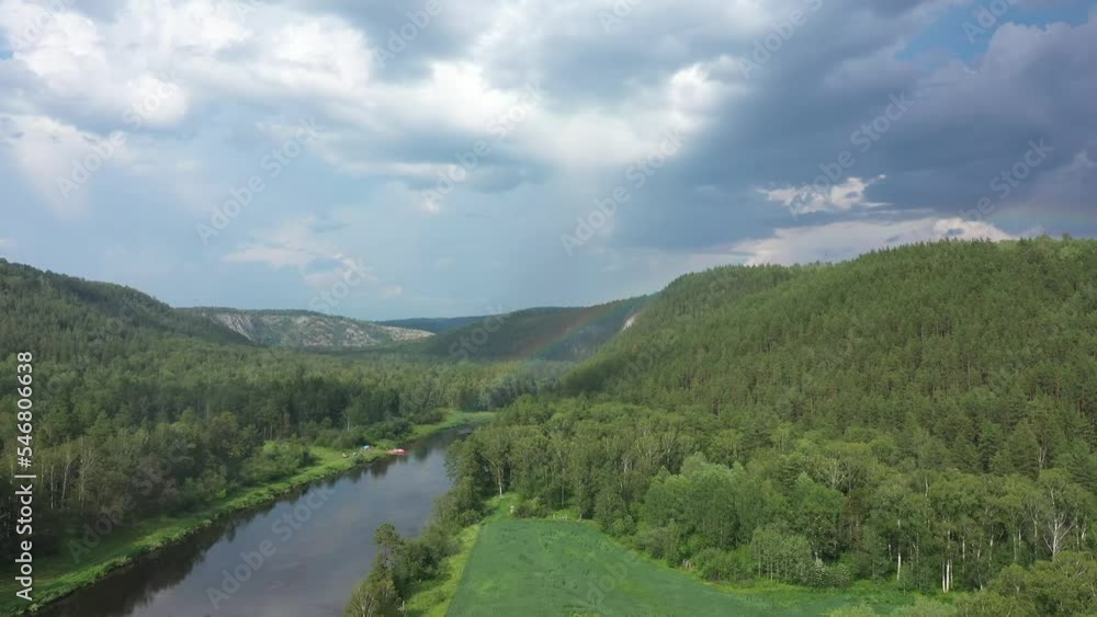 Aerial view of summer river and sunny rainbow. Green nature of Bashkortostan. River Agidel in summer Aerial view of summer river and sunny rainbow. Green nature of Bashkortostan. River Agidel in summer