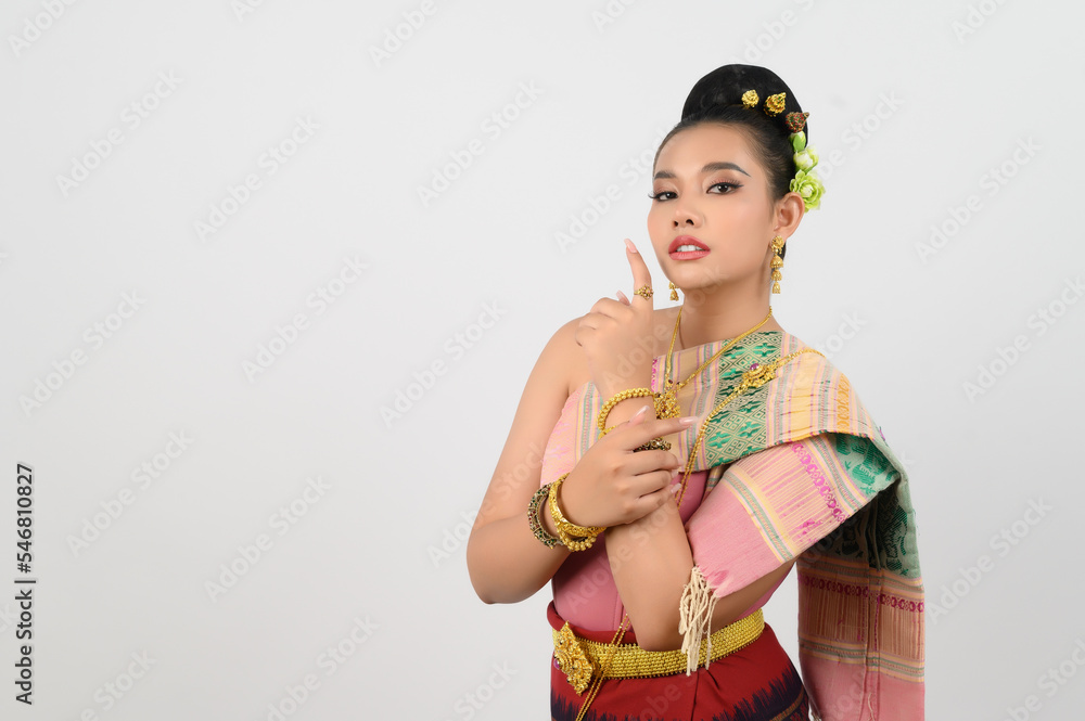 Young beautiful woman in northeastern dress stand and point finger posture Young beautiful woman in northeastern dress stand and point finger posture