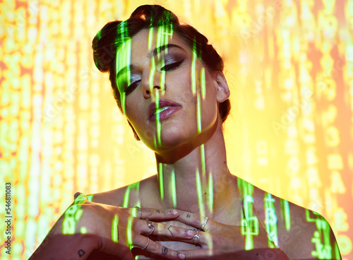 Futuristic, neon and projection on cyberpunk woman thinking with edgy makeup and hair style in studio. Dystopian, projection and 3d glow illumination on girl with serious face contemplating future.