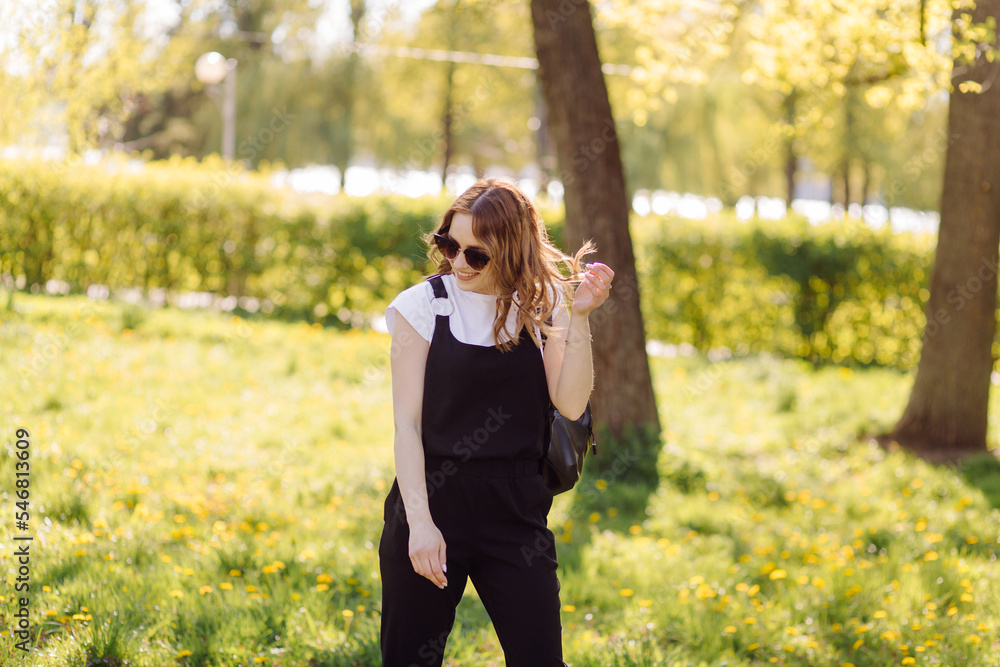 Portrait of young beautiful attractive woman at summer green park Portrait of young beautiful attractive woman at summer green park