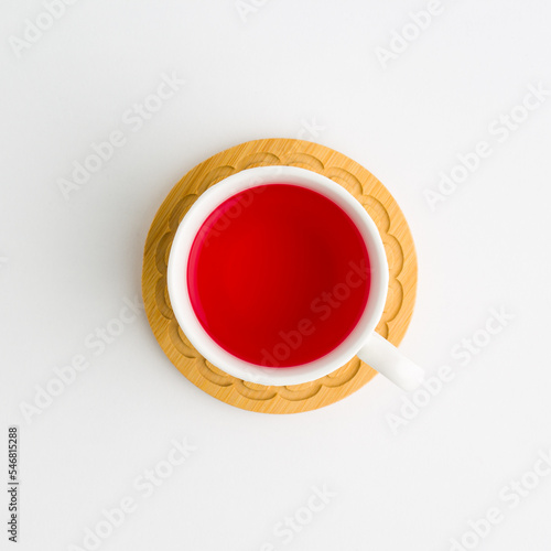 porzelan cup of strawberry tea. Isolated on white background photo