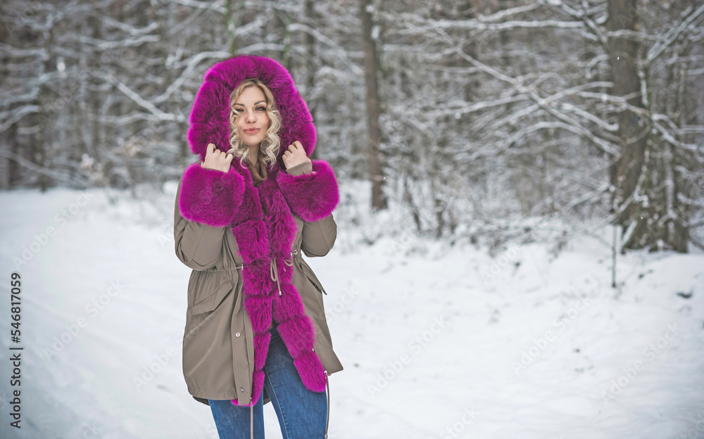 Beautiful woman on a walk in winter park. Cold time. A nice middle aged plus size woman standing on the street. Fashion lifestyle Beautiful woman on a walk in winter park. Cold time. A nice middle aged plus size woman standing on the street. Fashion lifestyle