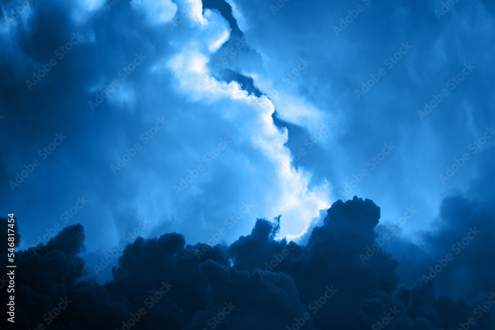 Dark blue toned sky with gloomy dramatic clouds. Backdrop background for mockup Dark blue toned sky with gloomy dramatic clouds. Backdrop background for mockup