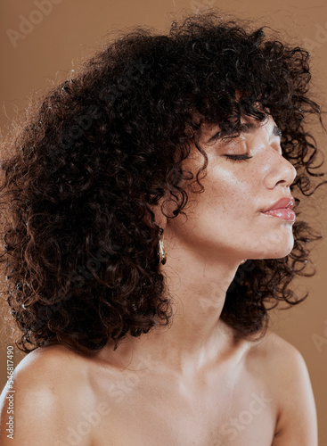 Bild auf Leinwand Face, beauty and hair with a model black woman in studio on a brown background for wellness or luxury
