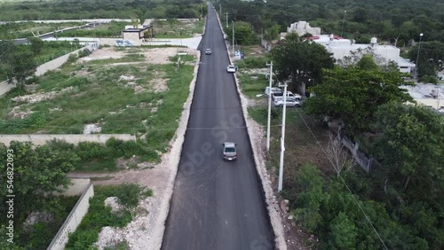 dron sobre carretera de pueblo en merida yucatan meico bonito inversion tererrenos photo