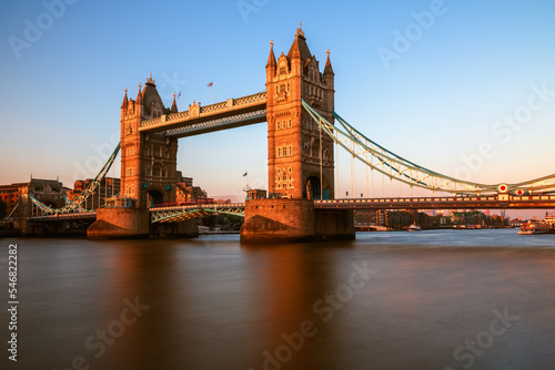 Tower Bridge over river Thames in London, England at sunset
