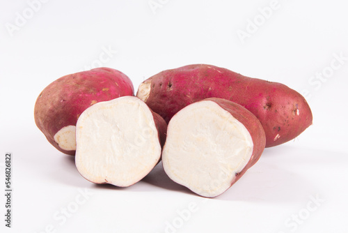 raw cut sweet potato isolated on white background
