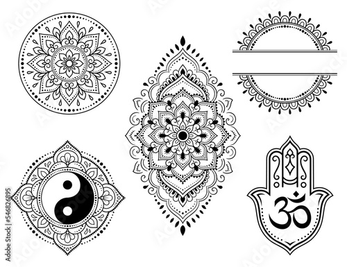 Set of Eastern ethnic religious symbols. Mandala with OM mantra, Yin Yang, Lotus flower. Decorative pattern for henna, mehndi, tattoos, room decoration. Outline doodle vector illustration.