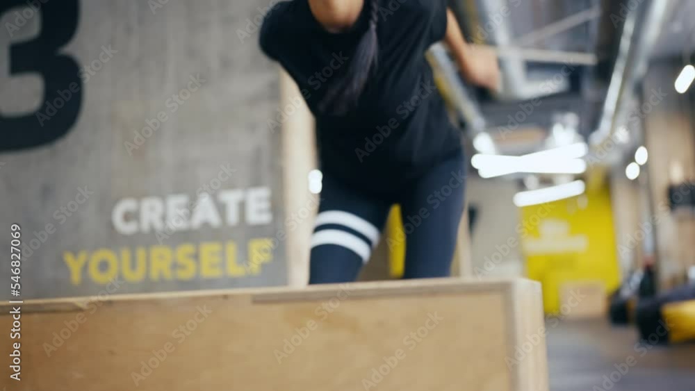 Closeup of female athlete doing jump training in gym, fatburning exercise Closeup of female athlete doing jump training in gym, fatburning exercise