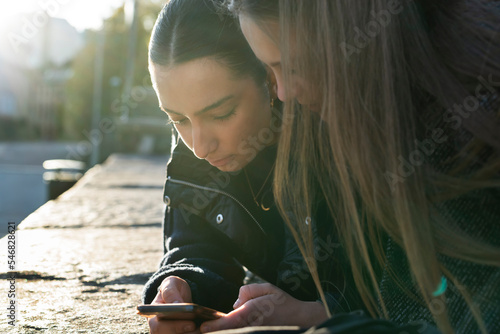 Young women using smart phone photo