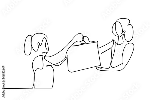 female employee cashier gives her bag to female customer after shopping