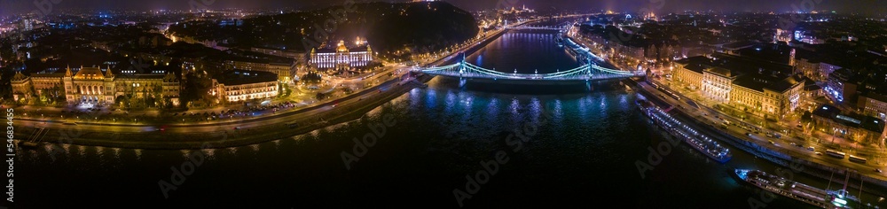 Aerial view around the city capitol Budapest in Hungary on an early night on an autumn day.