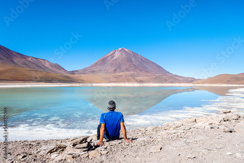 a man is taking a selfie in eduardo avaroa national park, bolivia photo