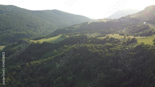 valley before sunset misty light in summer orbit shot photo