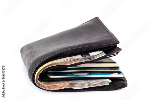 Picture concept with finance and banking. Brown leather wallet with money isolated on white background © pattanawit