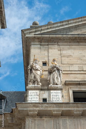 Corner of a roof on the granite facade to El Escorial Monastery in Madrid with statues of ancient kings. photo