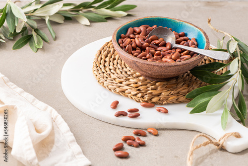 Dry raw butter beans in a bowl on a kitchen countertop. Cooking Healthy Food