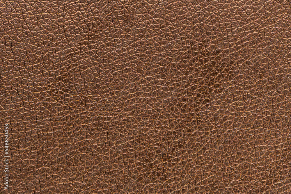 Brown bronze artificial or synthetic leather background with neat texture and copy space, colorful fabric sample with leather-like finish aimed for upholstery, fashion, sewing or footwear projects Brown bronze artificial or synthetic leather background with neat texture and copy space, colorful fabric sample with leather-like finish aimed for upholstery, fashion, sewing or footwear projects