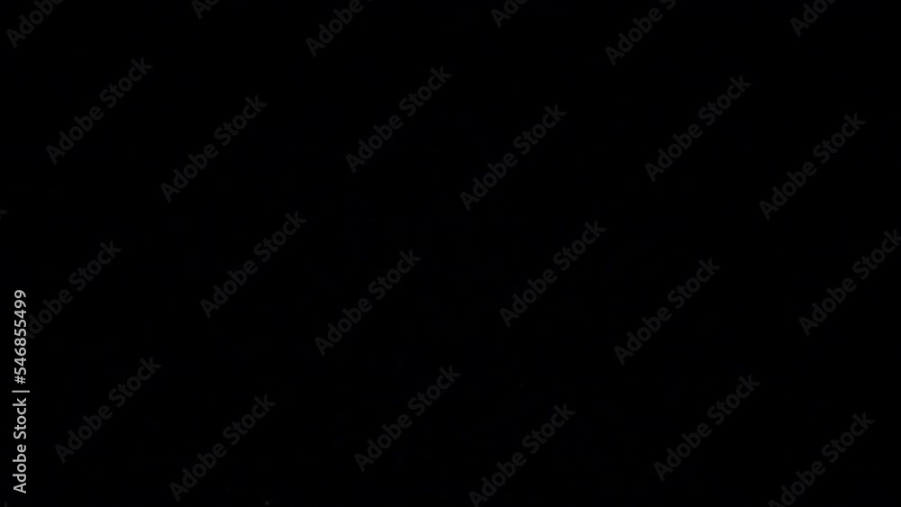 Spinach falling on black background. Slow motion Spinach falling on black background. Slow motion