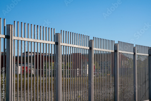 Borders  the fence with steel metal grate. Detail of the grate is made with a resistant and solid structure which increases the safety of the premises