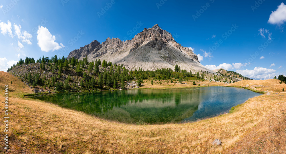Panoramic summer view from Col du Lauzet and its lake above the village of Saint-Crepin. Hautes-Alpes, Alps, France