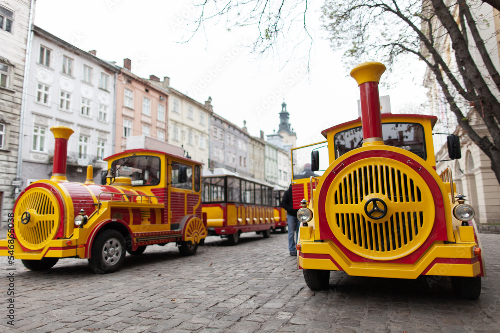 electric eco tourist train in the city of Lviv travels through the streets.