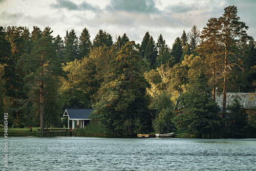 Recreation center on the lake shore in the forest Fototapet
