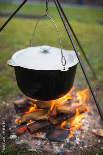 cauldron on fire for cooking hot food in nature.
