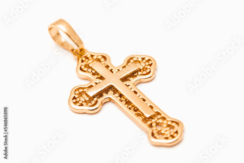 jewelry golden christian cross isolated on white background.