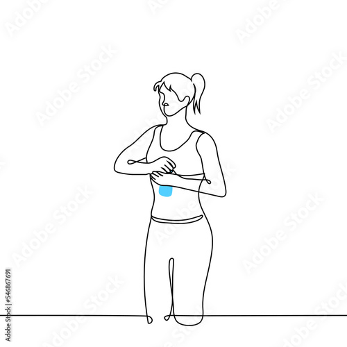 young woman in sports top and leggings opens a bottle of water - one line drawing vector. concept to quench thirst during training, replenish the water balance in the body