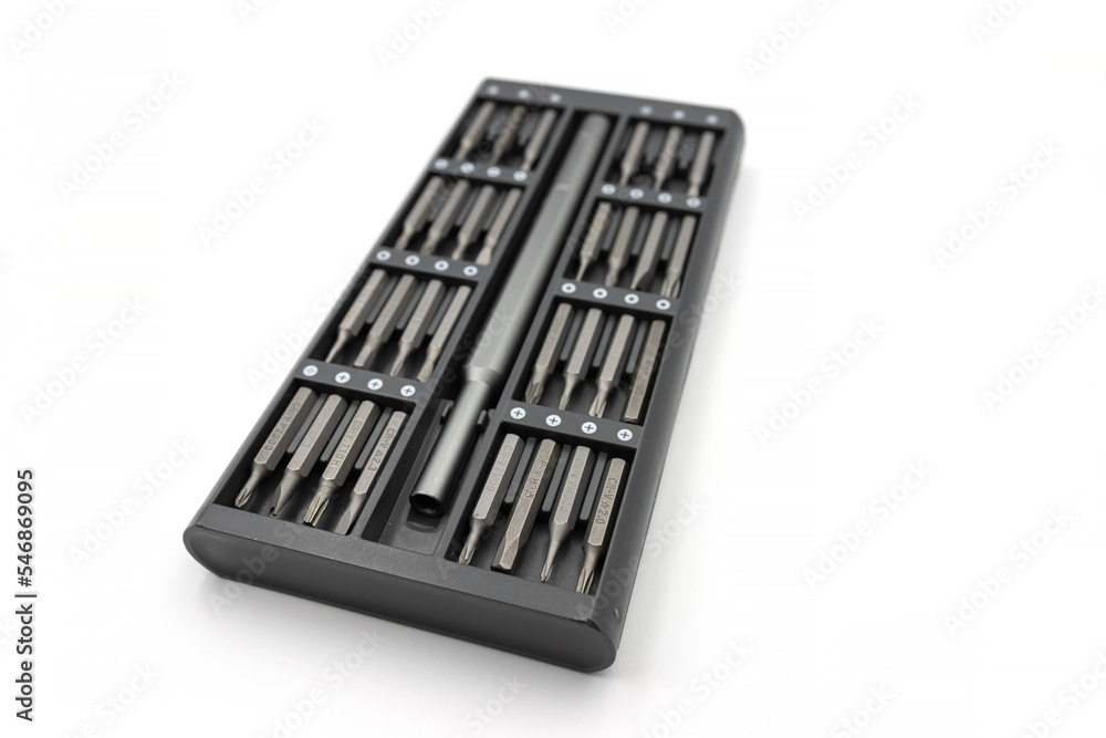 Screwdriver and macnite bits isolated on white background. Changeable screwdriver bits isolated white Screwdriver and macnite bits isolated on white background. Changeable screwdriver bits isolated white
