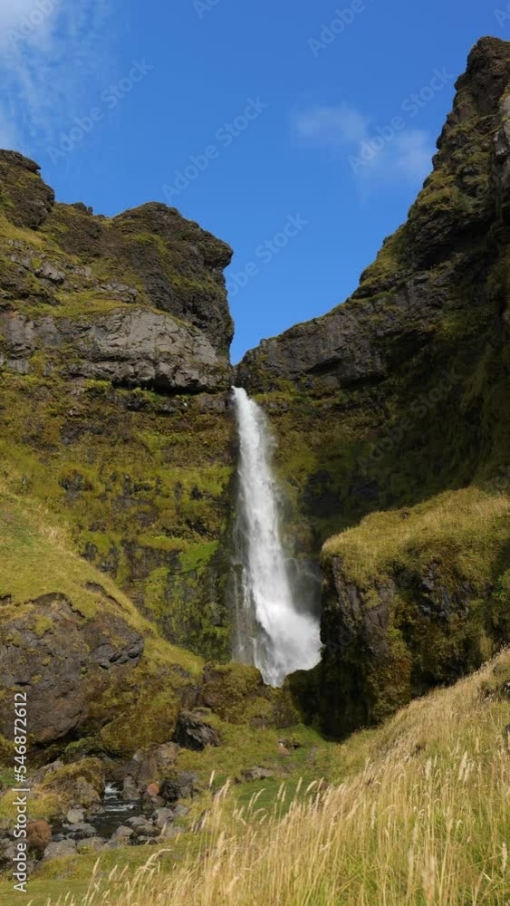 Irafoss Waterfall and Blue Sky in Iceland on a Sunny Day in September Vertical Video Irafoss Waterfall and Blue Sky in Iceland on a Sunny Day in September Vertical Video