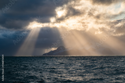 clouds and sun rays over the sea