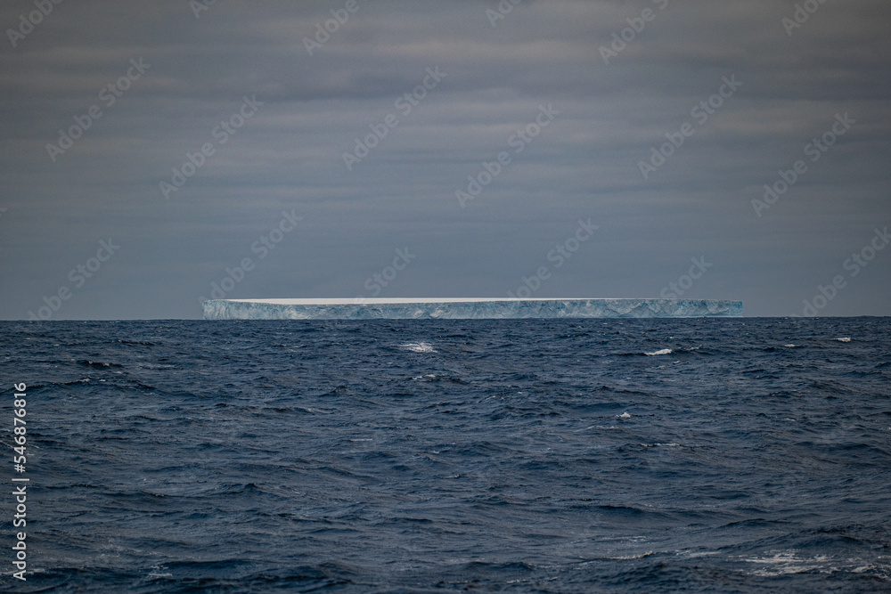 Huge tabular iceberg in the sea
