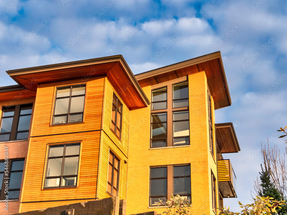 Top of residential building in golden sunset light Top of residential building in golden sunset light