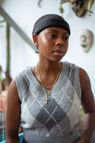 Fototapeta Portrait of young woman wearing waistcoat and woolen cap�