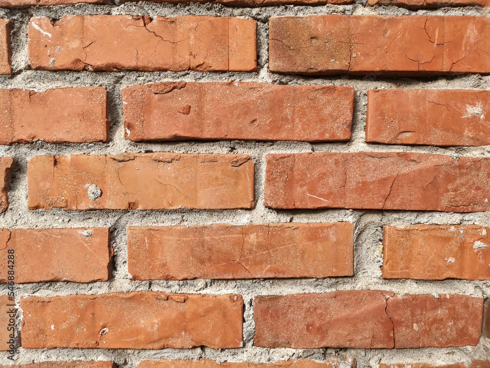 Fototapeta premium The wall made of an old brown bricks