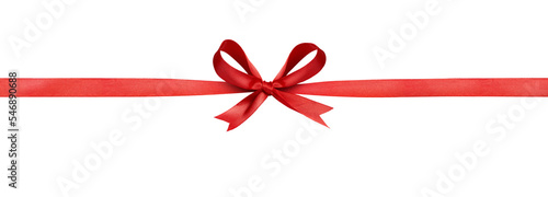 Foto A large red ribbon bow in the centre of a long straight piece of ribbon to be us