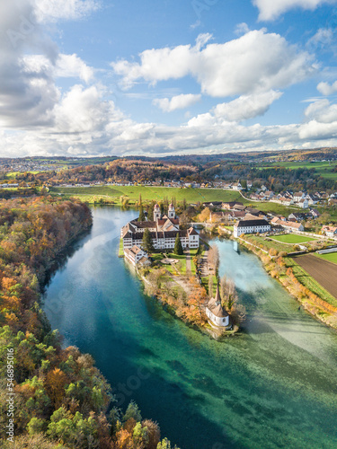 Aerial view of the Rheinau Abbey Islet on Rhine river in autumnal splendid colors, Switzerland