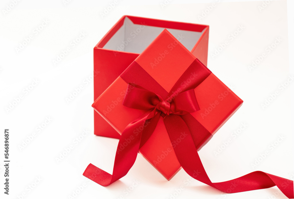 Red gift box with ribbon and bow open isolated on white background,