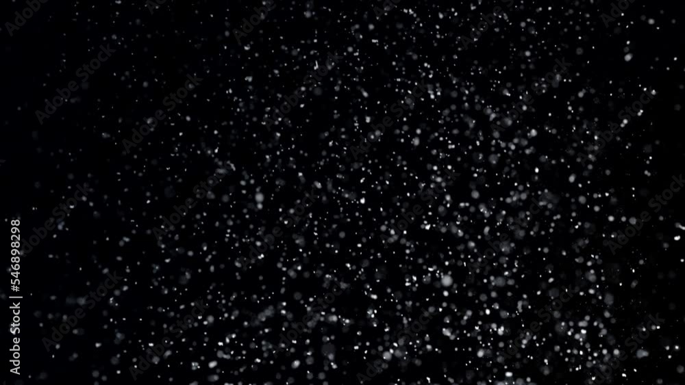Slowly falling snow on black background Slowly falling snow on black background