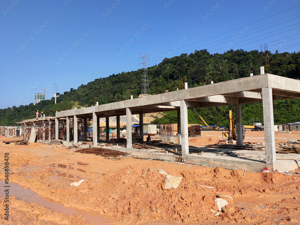 MELAKA, MALAYSIA - MARCH 4, 2021: The building structure is made of reinforced concrete still under construction. This reinforced concrete mold is made of timber and plywood formwork.