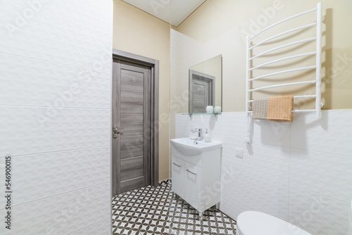 interior design of a bright bathroom with a shower cabin