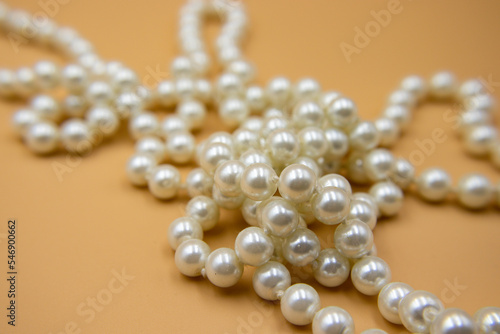 Close-up pearl necklace on isolated background.