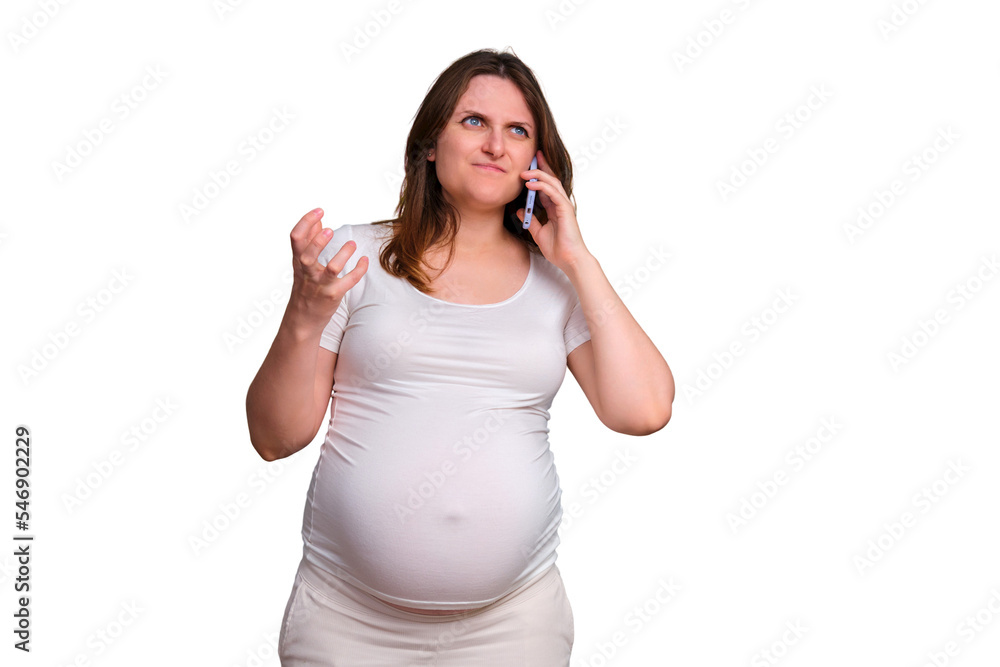 Portrait of a pregnant woman talking angrily on the phone on a white background Portrait of a pregnant woman talking angrily on the phone on a white background