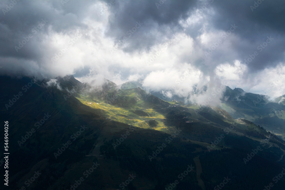 Austrian mountains with clouds and sun rays. Stubnerkogel. Austria. Summer. Bad Gastein.