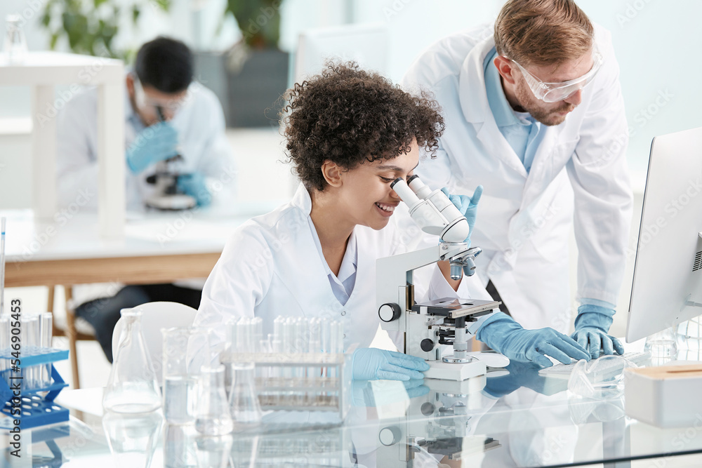 female scientist and her colleague are conducting research in the laboratory . female scientist and her colleague are conducting research in the laboratory .