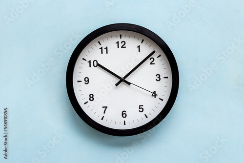 Black and white clock. Round wall clock - time to work concept
